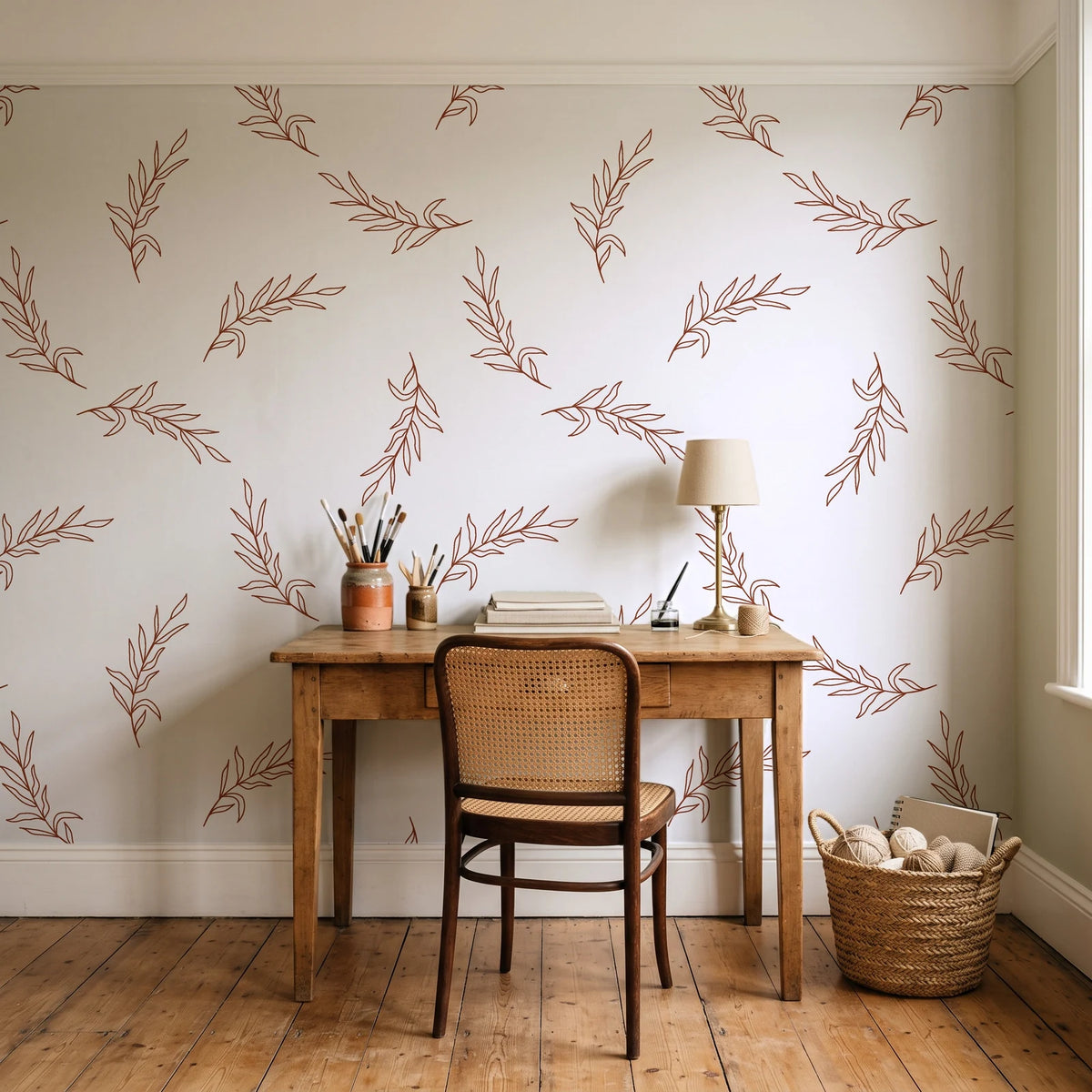 Willow Whisper Terracotta willow sprig wallpaper behind a vintage writing desk in a cozy craft-room home office