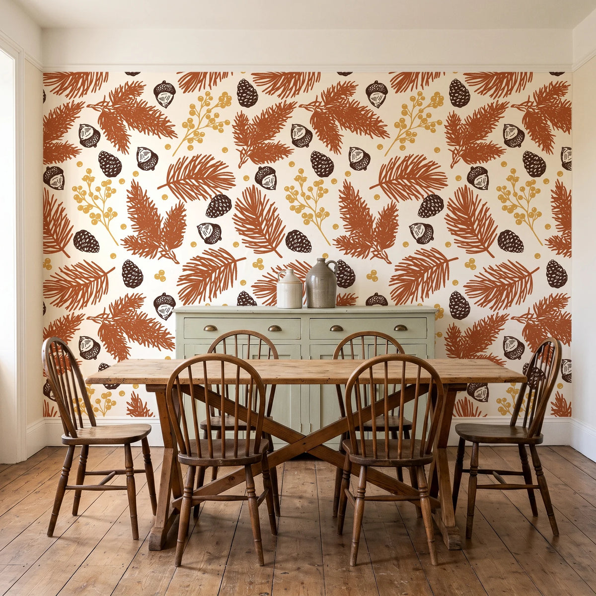 Winter Forage Terracotta pine bough and berry wallpaper in a farmhouse dining room with a sage sideboard and rustic trestle table