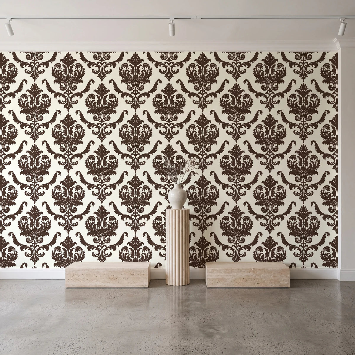 Woodland Blossom Veil Espresso damask wallpaper behind a travertine pedestal and vase in a minimal boutique