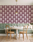 Woodland Blossom Veil Oxblood damask wallpaper as a feature wall in a sunlit breakfast nook