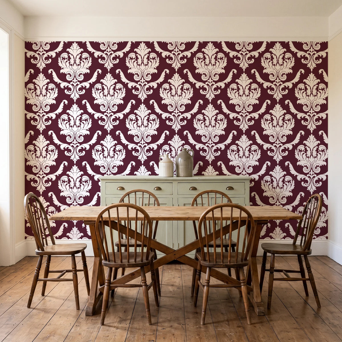 Woodland Blossom Veil Oxblood damask wallpaper in a farmhouse dining room with a sage sideboard and rustic trestle table