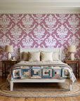 Woodland Blossom Veil Rose damask wallpaper behind a white cottage bed with a patchwork quilt in a cozy cottagecore bedroom