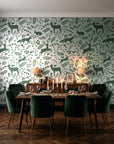 Woodland Hush Sage woodland animal wallpaper in a dark moody dining room with a candlelit table