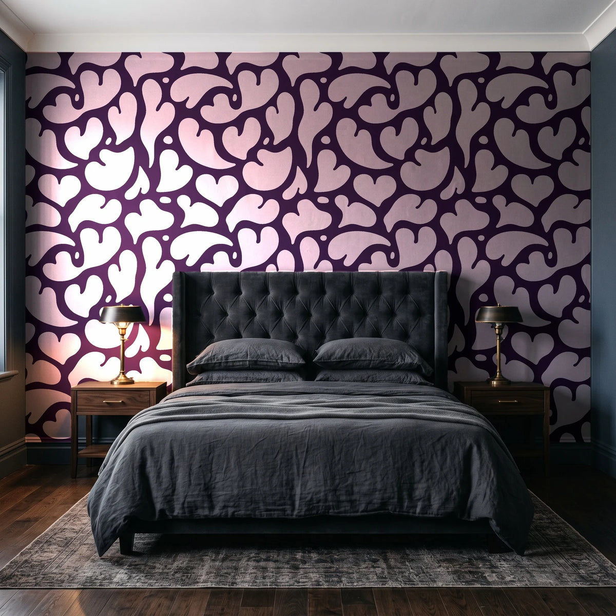 Woven Whisper Aubergine abstract heart wallpaper behind a tufted headboard in a dark, moody bedroom
