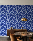 Woven Whisper Cobalt abstract heart wallpaper in an elegant dining room