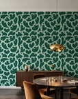 Woven Whisper Emerald abstract heart wallpaper in an elegant dining room
